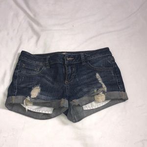 Folded distressed denim shorts